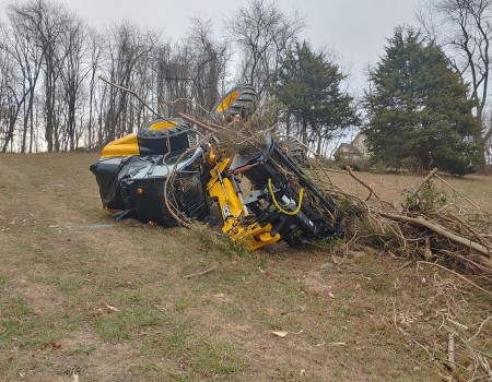overturned excavator needs moving